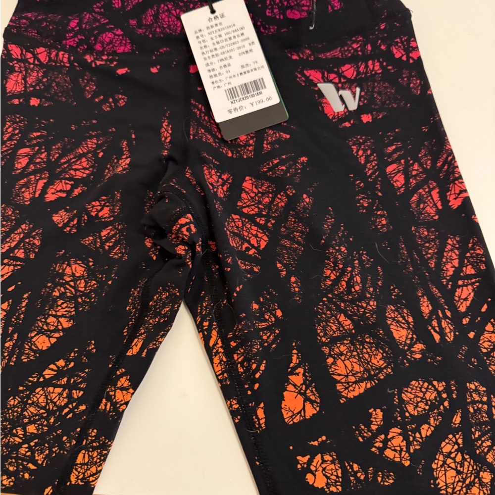 Dynamic Black and Orange Leggings for Active Wear